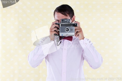 Image of Man Looking Through Old Medium Format Camera