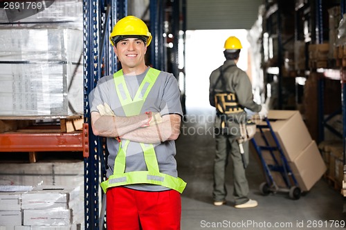 Image of Mid Adult Foreman With Arms Crossed At Warehouse