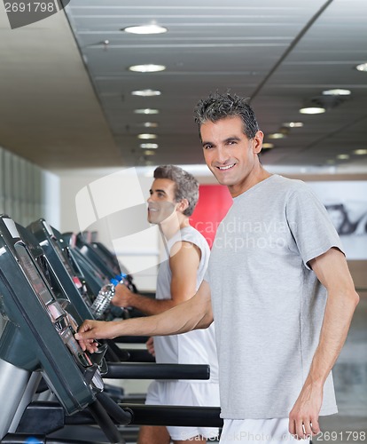 Image of Men Running On Treadmill