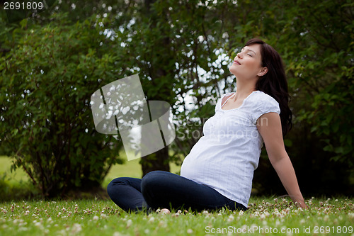 Image of Relaxed Mother in Park