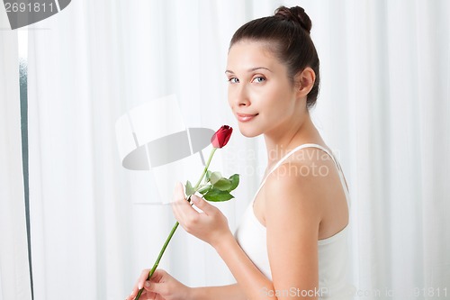 Image of Young Woman with a Rose