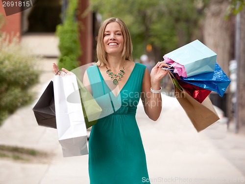 Image of Happy Shopping Woman Outdoors