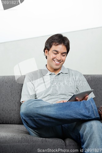 Image of Happy Man Using Digital Tablet