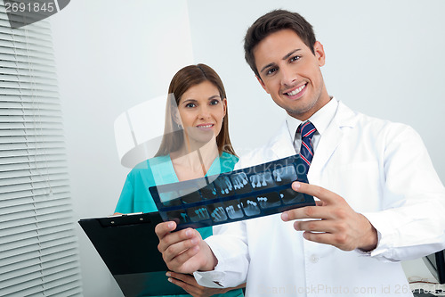 Image of Doctor And Assistant With Patient's Report