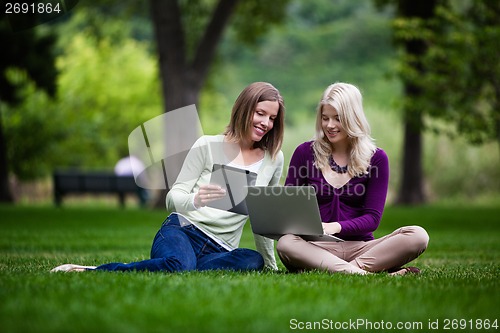 Image of Young Women in Park with Tech