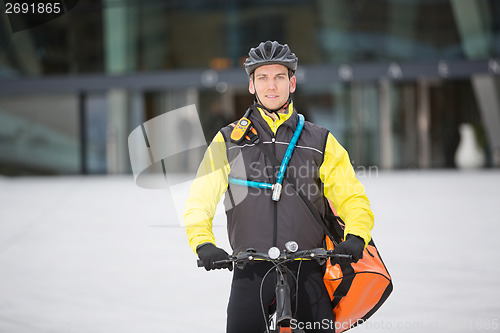 Image of Male Cyclist Carrying Courier Delivery Bag