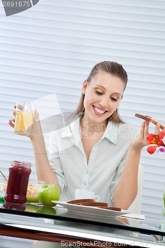 Image of Happy Woman Having Orange Juice