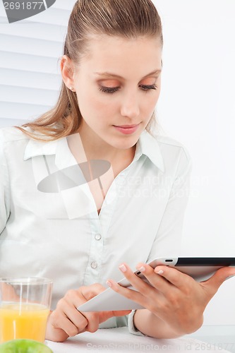 Image of Woman Using Digital Tablet