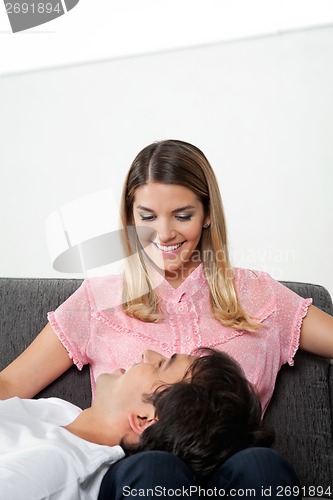 Image of Man Sleeping On Woman's Lap