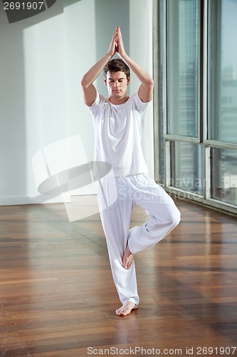 Image of Young Man Practicing Yoga