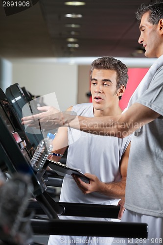 Image of Man Asking About Machines In Gym