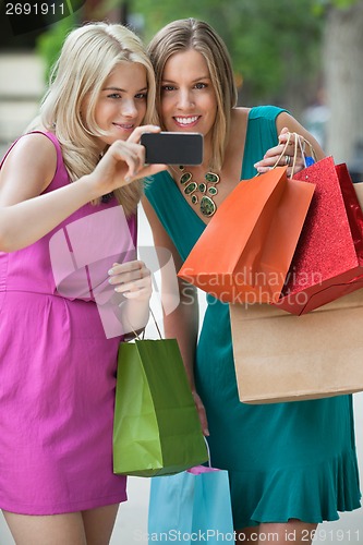 Image of Shopaholic Women Taking Selfportrait
