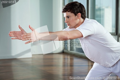 Image of Man Exercising At Gym