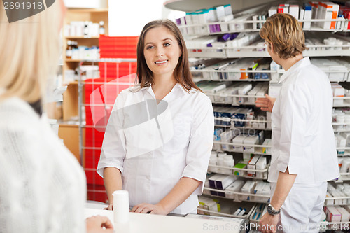 Image of Female Pharmacist Helping Customer