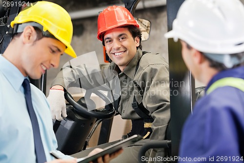 Image of Workers And Supervisors At Warehouse