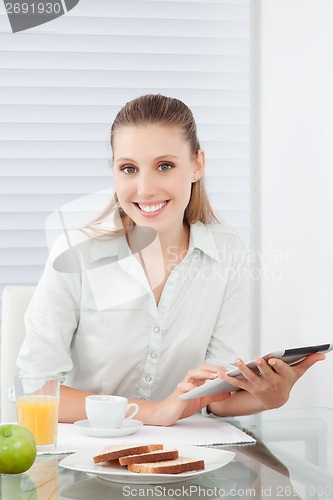 Image of Woman Holding Digital Tablet