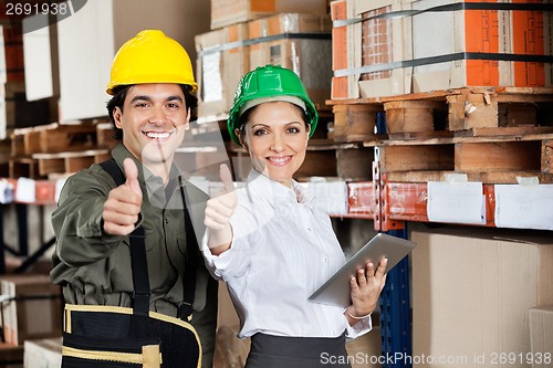 Image of Supervisor And Foreman Gesturing Thumbs Up