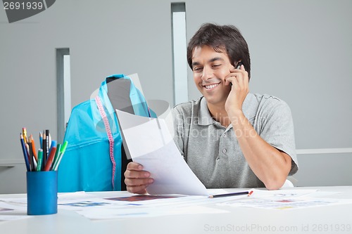 Image of Designer On a Phone Call