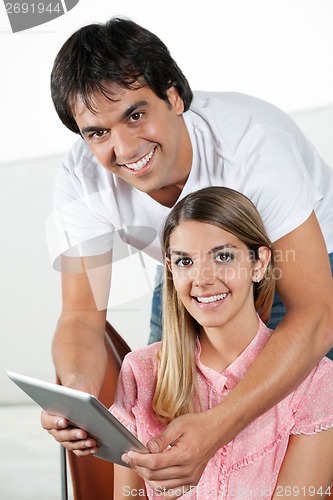 Image of Happy Couple With Tablet PC