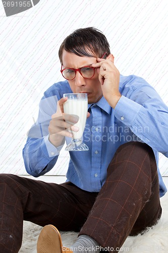 Image of Man holding Glass of Milk