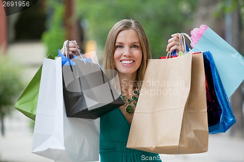 Image of Happy Woman With Shopping Bags