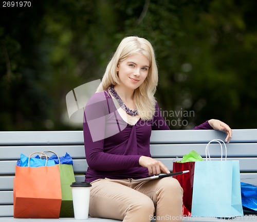 Image of Woman on Park Bench with Digital Tablet