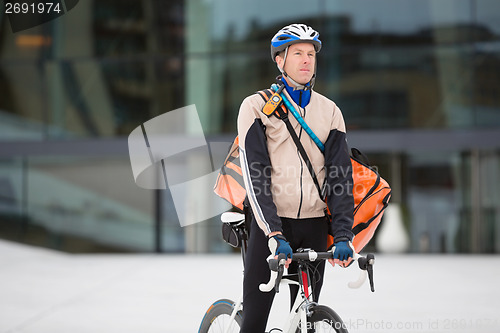 Image of Male Cyclist With Courier Delivery Bag