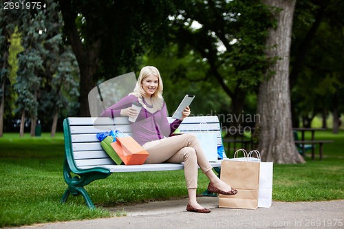 Image of Shopping Woman Using Digital Tablet