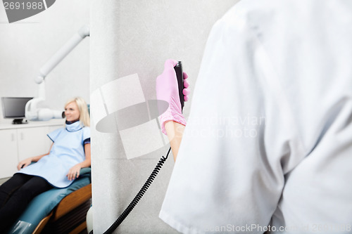 Image of Dentist Conducting Patient's X-Ray Test At Clinic