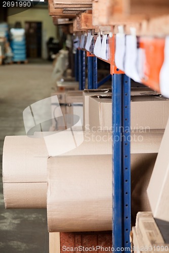 Image of Cardboard Rolls And Boxes Stored In Warehouse