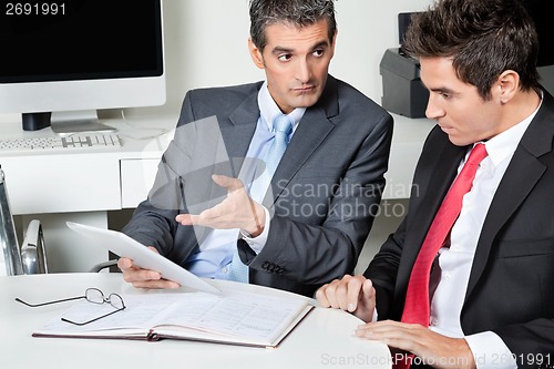 Image of Businessmen Using Digital Tablet At Desk