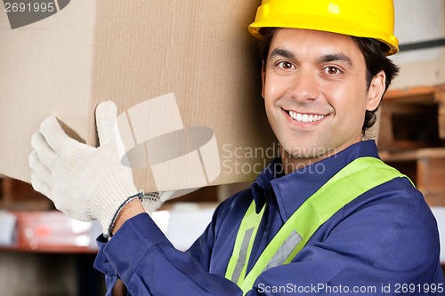 Image of Young Foreman Lifting Cardboard Box