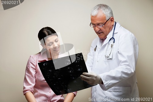 Image of Radiologist And Patient Looking At X-ray