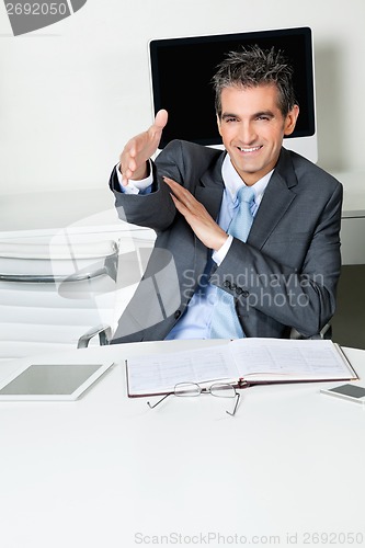 Image of Businessman Offering Handshake In Office