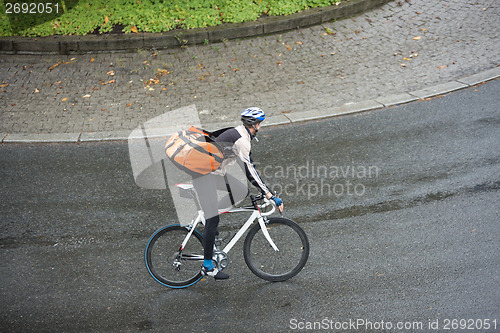 Image of Male Cyclist With Backpack On Street