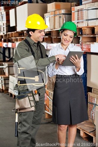 Image of Supervisor And Foreman Using Digital Tablet at Warehouse