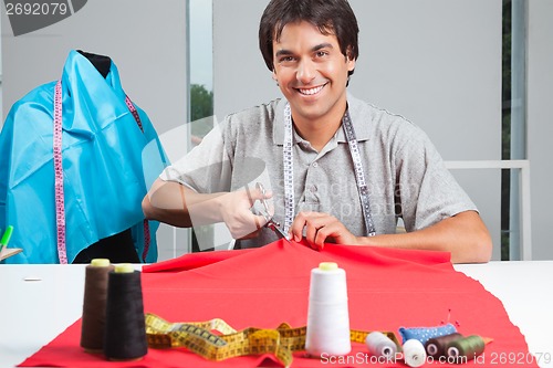 Image of Dressmaker Cutting Fabric