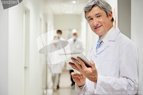 Image of Doctor Holding Digital Tablet