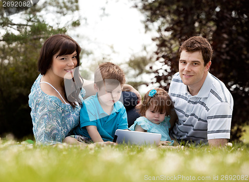 Image of Family with Digital Tablet Outdoors