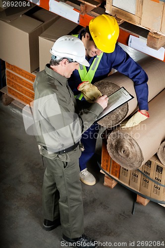Image of Foreman With Supervisor Writing Notes At Warehouse