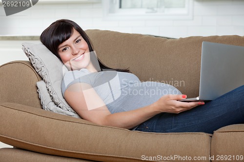Image of Relaxed Pregnant Woman Using Laptop