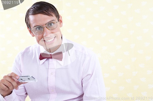 Image of Man Holding Old Audio Cassette