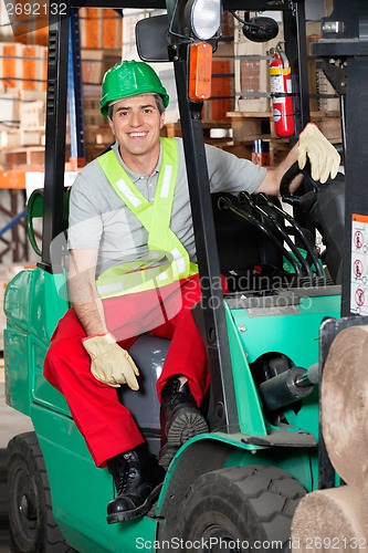 Image of Mid Adult Forklift Driver At Warehouse