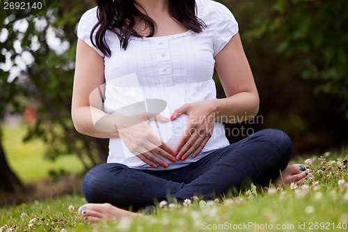 Image of Faceless Pregnant Woman