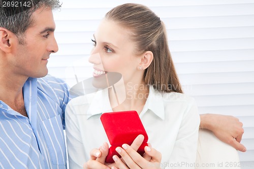Image of Couple Holding Box Ring