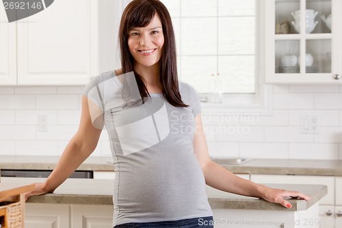 Image of Happy Pregnant Woman at Home