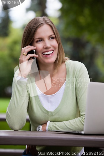 Image of Attractive Woman Talking on Cell Phone