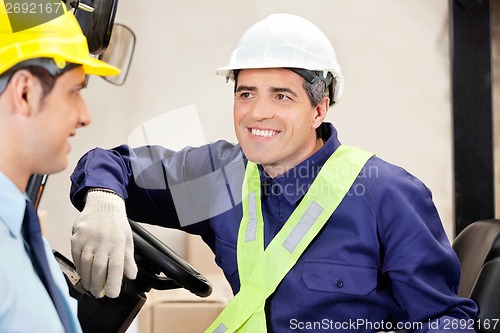 Image of Forklift Driver Looking At Supervisor