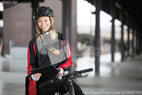 Image of Female Cyclist With Courier Bag