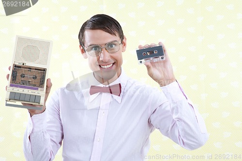 Image of Man Holding Old Audio Cassette